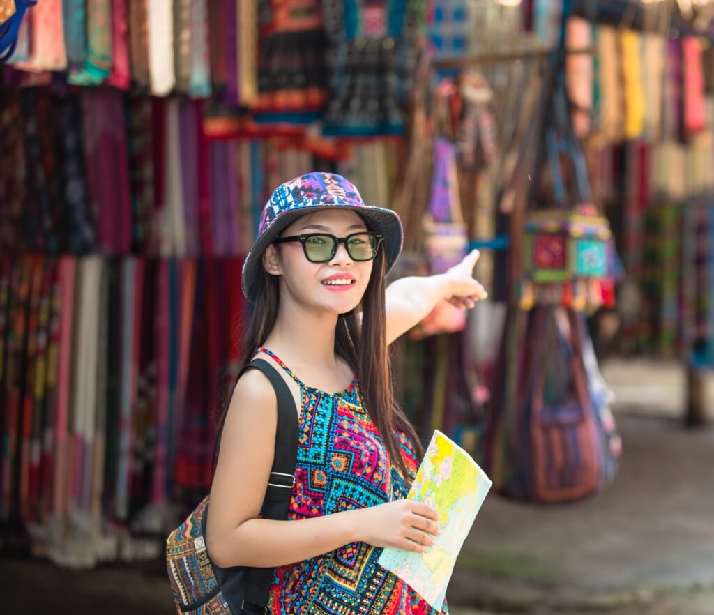 female tourists on hand have a happy travel map.